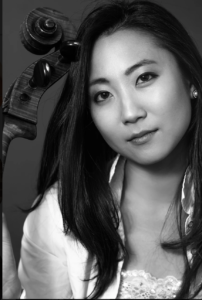 Black and white photo of Artistic Director Jia Kim with cello.